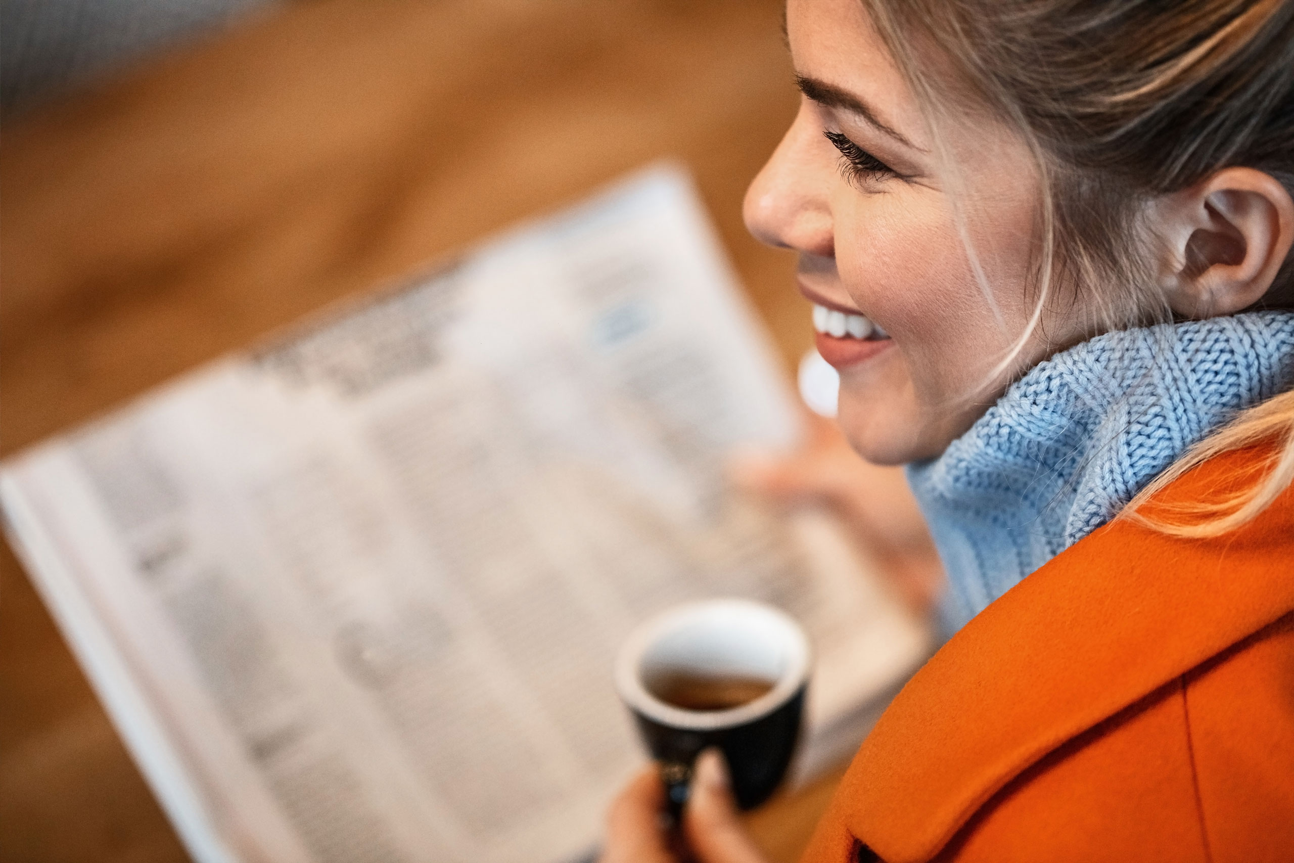 Dotlines UK - lady reading Dotlines news